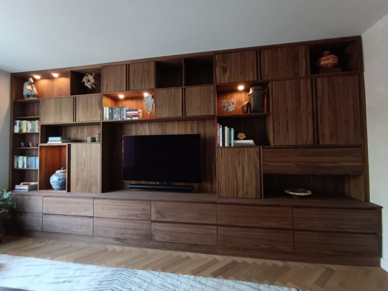 Custom-built walnut wall unit with TV niche